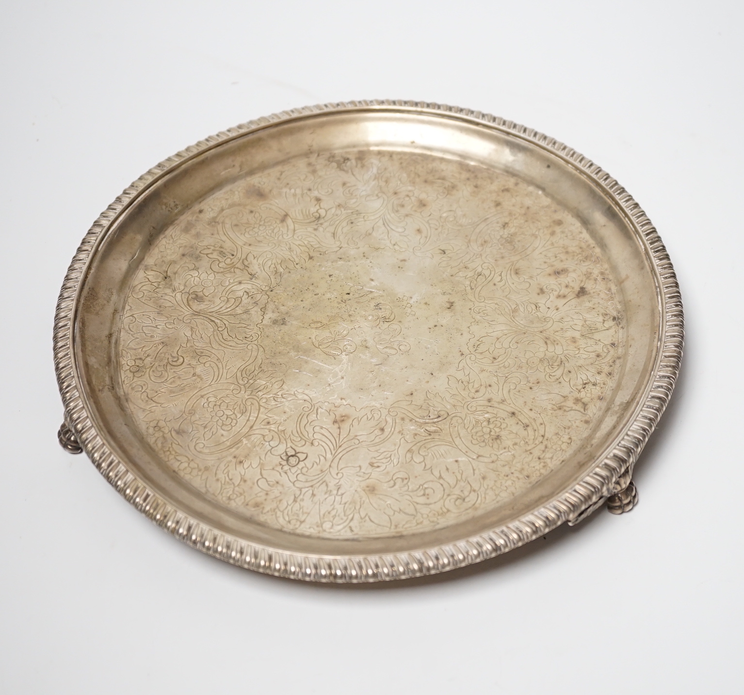 A George IV Scottish engraved silver circular salver, Mitchell & Sons, Glasgow, 1821, (centre gauge very thin), 24.9cm, 17.8oz.